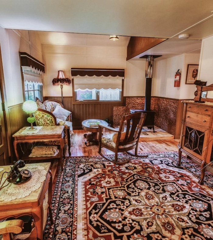 A cozy view of Kate Kennedy House's front porch